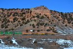 UP 8664, 9021, 7781 (SD70ACE, SD70ACE, C45ACCTE) lead an eastbound stack train at Castle Rock, Utah. February 19, 2022 {Winter Echofest}